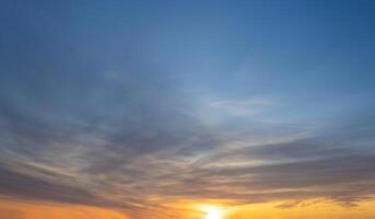 Dramatic sunset skies, cloudscape of rich color twilight sky. Sunset cloud background photo