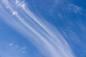 Scenic dramatic summer clouds. Cloudscape of bright blue sky. Cloud background. photo