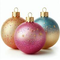 Three colorful Christmas baubles with glitter, isolated on a white background photo
