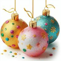 Three colorful Christmas baubles with glitter, isolated on a white background photo