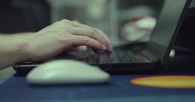 close up person working on laptop, hands of businessman typing on keyboard. video