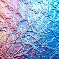 A shiny foil background with a blue and pink color photo