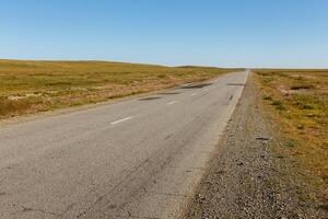 asphalt road in the Mongolian steppe photo