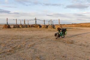 Mongolian Ovoo and bicycle photo