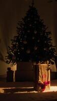 The First Christmas Gift Box For Children On Carpet In Front Of The Unlit Tree video