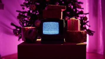 Vintage Television With No Static Signal Screen Under Bright Christmas Tree video