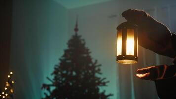 Vintage Lantern Of A Mysterious Man At Night In A Room With Unlit Christmas Tree video
