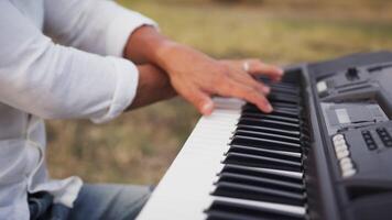 Hands Of A Boy Play The Musical Keyboard Crossing In Rhythm In The Countryside video