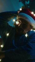 Man Has Fun On Christmas Eve Surrounding Himself With Wire Light In The Room video