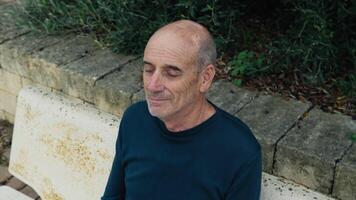 Bald Man Sleeps On A Bench In The City Square While Resting video