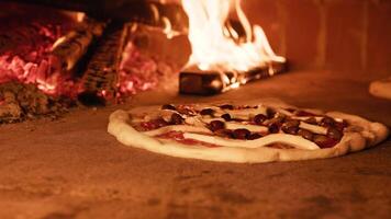 Wood Oven And Pizza Cooking With Olives And Mozzarella Cheese video