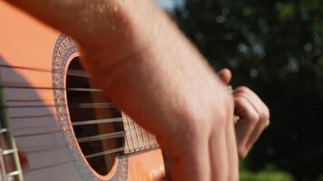 Hands Play The Strings Of A Guitar Classical Music In The Natural Park video