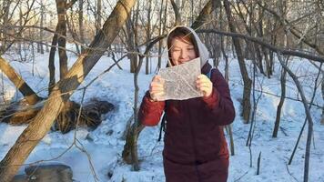 Child enjoys winter adventure exploring frozen forest with ice crystal discovery and laughter. video