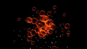 Flying soap bubbles among the falling sparkling sparks. Black background. Abstract animation. video