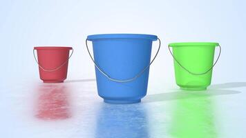 Plastic Buckets on a Reflective Floor. Different Colors of Buckets 3D. 4K video