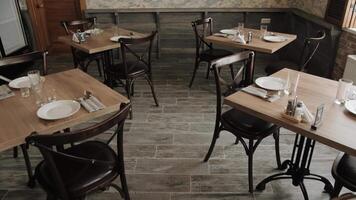 Restaurant design. Tableware. Waiting for the guests. An empty cafe in a wooden style. Free tables. There are no visitors. Restaurant design. Tableware. Waiting for the guests. video