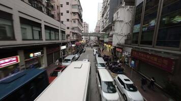 Mong Kok, Hong Kong - 01 03 2024 FPV drone flight on street near rush hour video