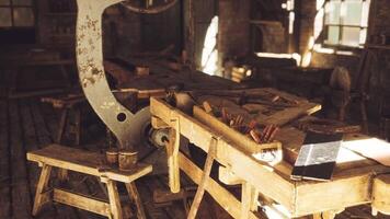 Workshop with tools and machinery in a rustic setting during daylight hours video