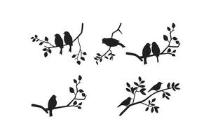 Set of birds at tree branches silhouettes. vector