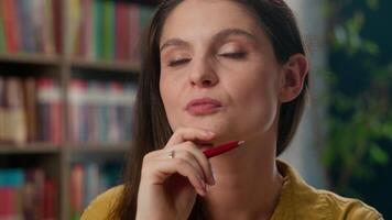 Portrait happy smiling Caucasian woman clever teacher tutor teach in academy class library thinking serene female dream girl high school student studying learning in university college education study video