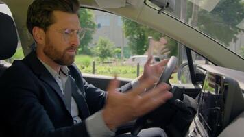 Caucasian man male businessman guy upset driver car owner inside automobile stressed confused auto navigation electric transport navigator road destination error mistake device gps app drive traffic video