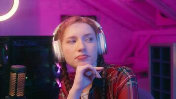 Thoughtful girl teen woman gen z teenager student streamer blogger influencer radio host cyber sport gamer thinking playing online game computer gambling come up with idea happy insight gesture video