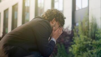 Anxious thinking stressful thoughtful leader worker bankrupt male business manager think solution problem man suffer unwell trouble migraine headache symptom failure Indian businessman stress in city photo