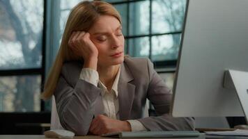 Tired sleeping lazy napping businesswoman boring with work in office with computer overworked exhausted sick ill woman worker need some rest at workplace sleep nap fatigue burnout manager at table photo