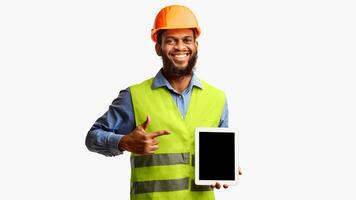 Builder Worker Showing Digital Tablet Empty Screen Pointing Finger Standing Over White Background. Panorama, Studio Shot photo
