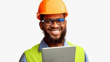African Architect Man Using Tablet Computer Smiling To Camera Posing On White Studio Background, Wearing Construction Worker's Helmet And Vest. photo