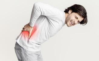 Inflammation and pain in lower back is highlighted in red photo