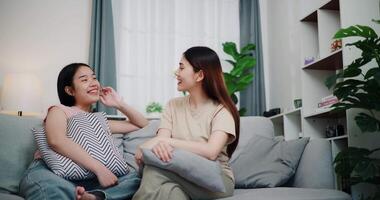 Handheld shot, Asian female couple share good feelings for each other and hold hands with their pinky fingers, indicating a good relationship or sincere promise, Happy times at home video