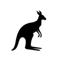 Silhouette of a kangaroo hopping in an open landscape during daylight vector