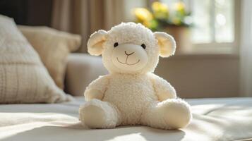 A soft, cuddly sheep toy is placed on a neatly made bed, basking in warm sunlight streaming in through a nearby window, creating a peaceful atmosphere. photo
