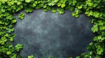Bright green clover leaves frame textured dark surface for natural decor photo