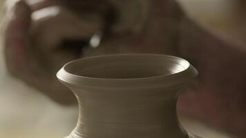 Mouth of a new vase of mud recently made by a potter spinning in the lathe video