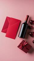 Romantic gift arrangement with red envelopes, wine bottle, and hearts on pink background photo