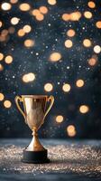 Golden trophy with bokeh lights on a dark background during a celebration event photo