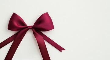 Elegant red ribbon displayed on a white background for gift wrapping or decoration projects photo
