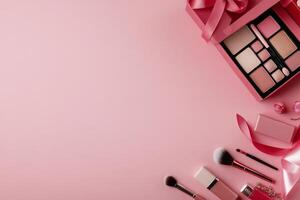 Makeup items arranged on a pink background for a beauty themed layout or display photo