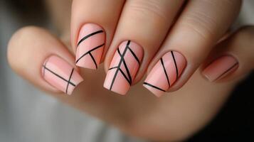 Stylish nail art with geometric design in soft orange tones on well groomed hands photo