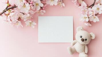 Elegant spring blossoms gently framing a blank card on a soft surface photo