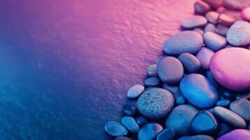Colorful stones create a vibrant background with shades of blue and purple under soft lighting photo