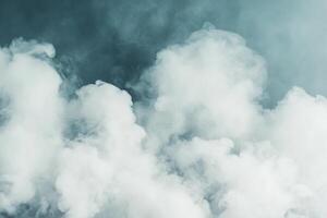 Volcanic ash plume rises into the sky over a barren landscape during daylight hours photo