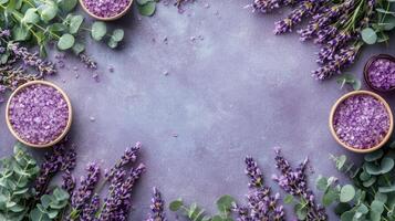 Lavender flowers and eucalyptus leaves on a purple background photo