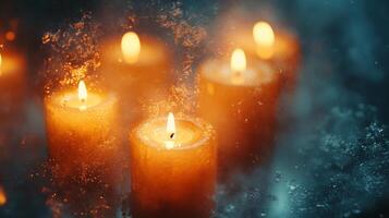 Candles burning in the dark with water splashing photo