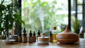 Essential oils and diffusers on a wooden table photo