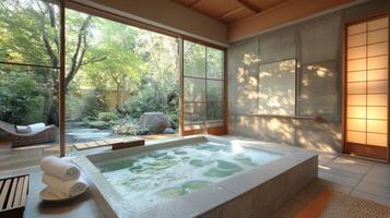 A japanese style bathroom with a large tub photo