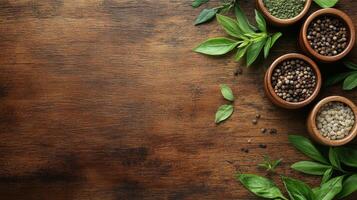 Spices and herbs on wooden table top view photo