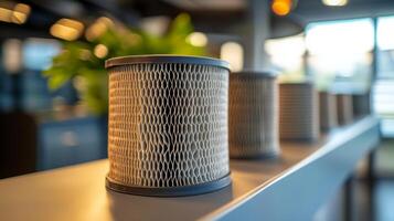 A row of three air filters on a shelf photo